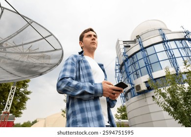 Engineer at work: a specialist tests mobile communication after detecting a malfunction, ensuring stable and reliable service.
