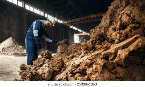 Engineer worker control quality clay for brick production, Ceramic factory industry.
