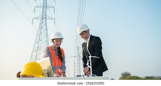 Engineer Worker With Electric Pole And Blue Sky