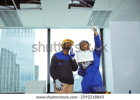 Engineer and worker inspect at worksite on bulding. two construction worker with laptop. Renovation and interior decoration concept.