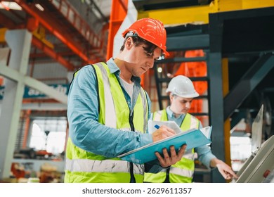 Engineer worker team of technicians collaborating on production line inside factory, wearing safety helmets reflective vests, performing inspection adjustments to ensure smooth industrial operations