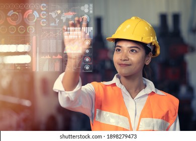 Engineer worker using advance technology digital hologram infographics touch panel in industry factory.