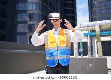 Engineer or worker wearing virtual reality glasses(VR) at urban industrial site