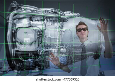 Engineer working with 3D display of Jet Engine, seen through interactive screen
