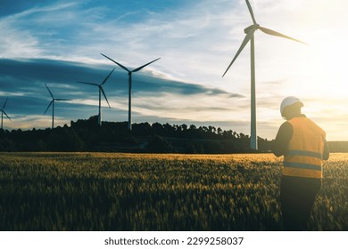 Engineer working at alternative renewable wind energy farm - Sustainable friendly industry concept - Powered by Shutterstock