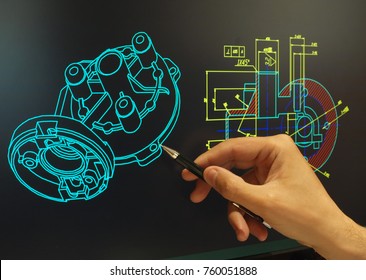 Engineer Working At Computer On Mechanical Piece Design   