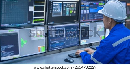 Engineer working at control room, Manager control system, Technician man monitoring program from a lot of monitor.Specialist observes analytics dashboard,operator inspects digital interface
