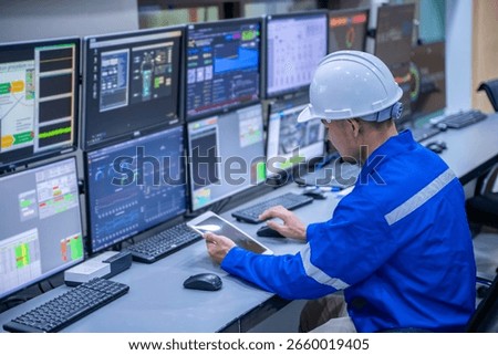 Engineer working at control room, Manager control system, Technician man monitoring program from a lot of monitor.Specialist observes analytics dashboard,operator inspects digital interface