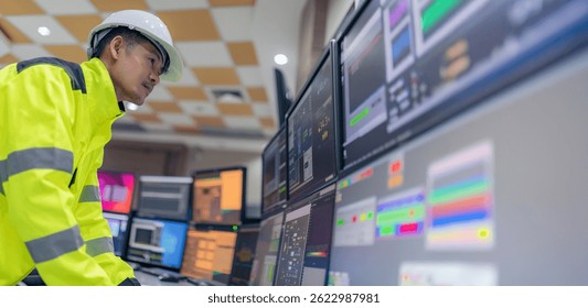 Engineer working at control room,Manager control system,Technician man monitoring program from a lot of monitor