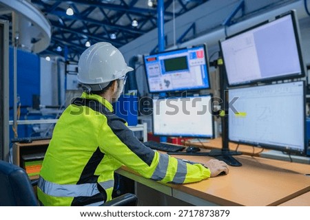 Engineer working at control room,Manager control system,Technician man monitoring program from a lot of monitor