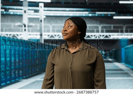 Engineer working in data center with rigs layout supporting business technology needs. Server farm employee doing checkup, ensuring infrastructure works at optimum performance for smooth operations