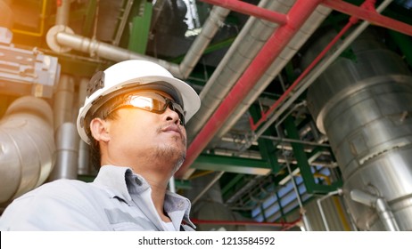 Engineer Working In Engineering Complex Of Petroleum Oil Refinery Plant , Construction Phase