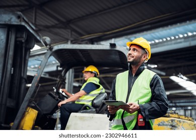 Engineer are working in the factory. Mechanical technicians are maintaining the engine. Worker with a forklift in a warehouse.