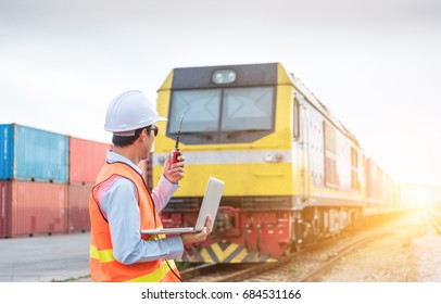 Engineer Working In The Freight Train Station