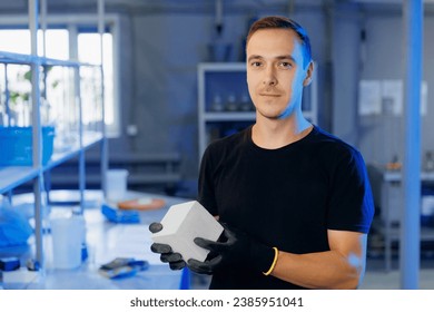 Engineer working in industry lab for testing building materials. Controls size and quality of concrete cube in laboratory. - Powered by Shutterstock