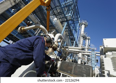 Engineer Working Inside Large Oil And Gas Refinery, Chemical Plant.