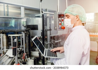 Engineer Working With Laptop In Food Factory Machine Production Inspector With Hygiene Clothes.