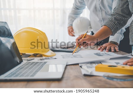 engineer working in office with blueprints, inspection in workplace for architectural plan, construction project ,Business construction	