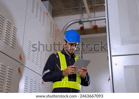Engineer is working on the basement of high rise building. Engineering and utility system.