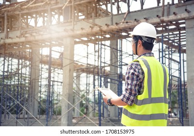 engineer working on building site - Shutterstock ID 1708153975