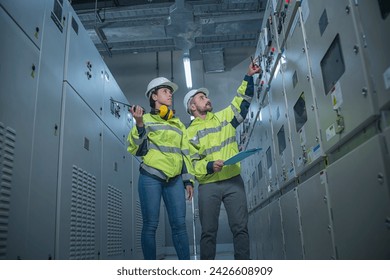 engineer working on the checking status switch gear electrical energy distribution substation - Powered by Shutterstock