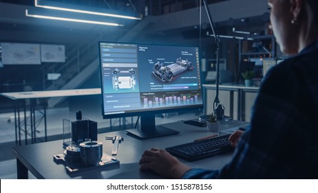 Engineer Working On Desktop Computer, Screen Showing CAD Software With Car Efficiency And Engine Concept. Industrial Design Engineering Facility. Over The Shoulder Shot