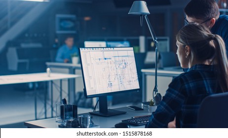 Engineer Working on Desktop Computer, Screen Showing CAD Software with Technical Blueprints, Her Male Project Manager Explains Job Specifics. Industrial Design Engineering Facility Office - Shutterstock ID 1515878168