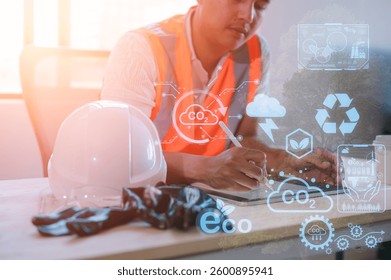 engineer working on digital tablet project planning to reduce CO2 emissions carbon footprint climate change to limit global warming.Sustainable development