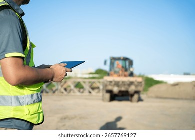 engineer working on digital tablet in construction site