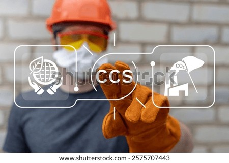 Engineer working on virtual touch screen push abbreviation: CCS. CCS Carbon Capture Storage for utilization concept. CO2 capture for storage until it is sold to carbon market.