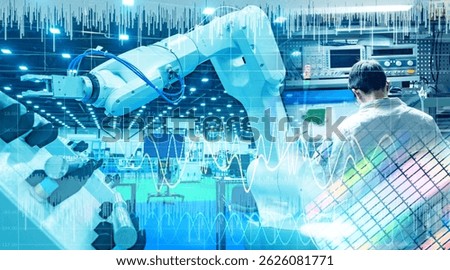 Engineer working with robotic arm and digital interface in a high-tech manufacturing facility, representing industrial automation and smart factory technology. – Technology. Manufacturing.