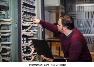 Engineer working in server room