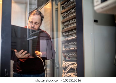 Engineer working in server room