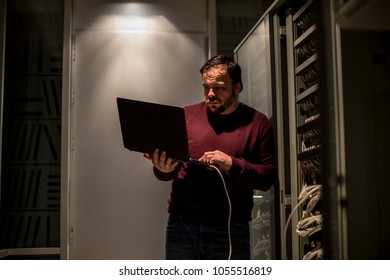 Engineer working in server room