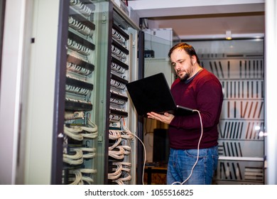 Engineer working in server room