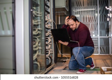 Engineer working in server room