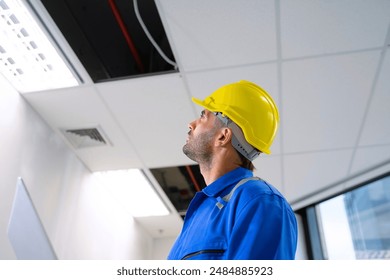 Engineer is working at tower. Construction and engineering.