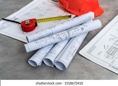 Engineer workplace . Blueprint rolls and engineering tools.