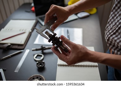 Engineering Is Checking The Metal Wheel For Future Car Assembly.