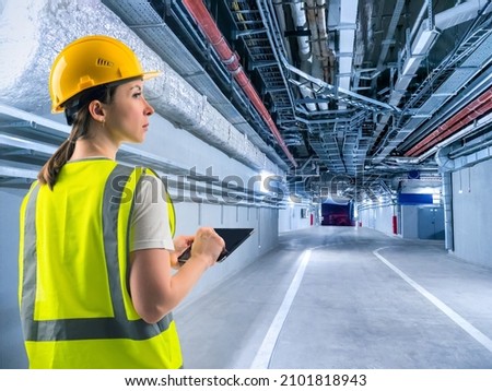 Engineering communications specialist. Engineer under ventilation and communication pipes. Engineer in back rooms in business center. Engineering communications under ceiling of corridors.