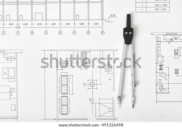 Engineering compass is on building plan.
Workplace of architect, constructor, designer in top view.
Engineering project. Construction and architecture. Architect
drawing. Exact
calculation.