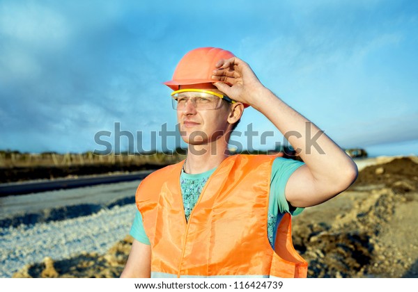 engineering construction company, building a new
road construction in
overalls