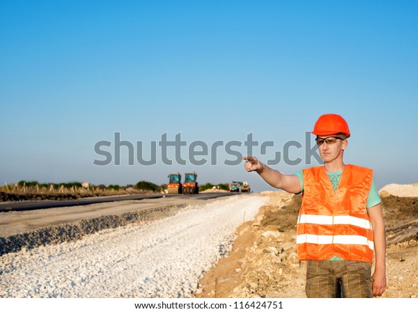 engineering construction company, building a new
road construction in
overalls