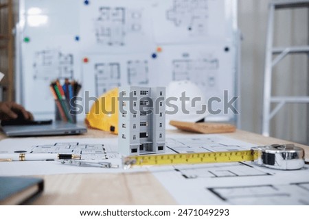 engineering is currently discussing structural design issues with architects to review plans to suit construction and stability of building. concept joint consultation between engineers and architects
