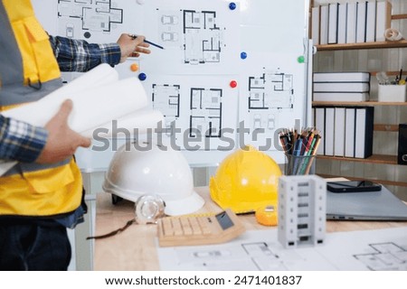 engineering is currently discussing structural design issues with architects to review plans to suit construction and stability of building. concept joint consultation between engineers and architects