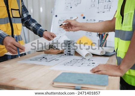 engineering is currently discussing structural design issues with architects to review plans to suit construction and stability of building. concept joint consultation between engineers and architects