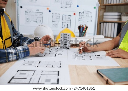engineering is currently discussing structural design issues with architects to review plans to suit construction and stability of building. concept joint consultation between engineers and architects