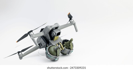 Engineering development for war, army drone with mechanism for dropping grenades on white isolated background. Concept military UAVs using in weapon.