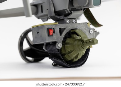 Engineering development for war, mechanism for dropping grenades from army drone on white isolated background. Concept military UAVs using in weapon.