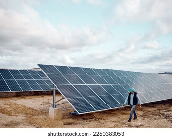 Engineering expert, outdoor and solar panel inspection for future, renewable energy or sustainability of world. Photovoltaic innovation, clean electricity or sustainable goal on earth for man on walk - Powered by Shutterstock